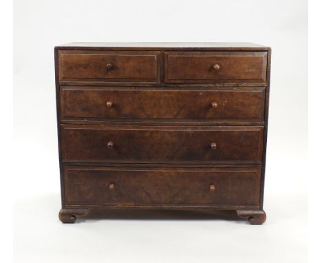 A 1920s elm and walnut faced chest of two short and three long drawers on ogee bracket feet, 107cm wide, 54cm deep, 93cm high