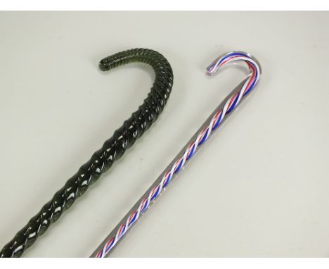 Two Victorian glass 'friggars' in the form of walking sticks, the first clear with red, white and blue opaque twist, 62cm lon