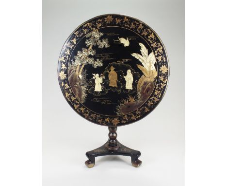 A Chinese export lacquer tilt-top occasional table, 19th Century, the circular tilt top above a turned support and triform co