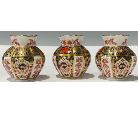 A pair of Royal Crown Derby Imari 1128 pattern miniature lobed ovoid vases, 8cm, seconds, printed marks; another, first quali