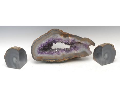 Natural History - Geology - an amethyst geode, outlined with polished agate border, 21cm high, 38cm wide; a pair of polished 