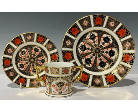 A Royal Crown Derby Imari 1128 pattern two handled loving cup, 8cm, printed mark, first quality; an 1128 side plate and a tea