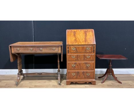 A George III style bureau, of narrow proportions, 100.5cm high, 54cm wide, 43cm deep; a Regency style sofa table; a wine tabl