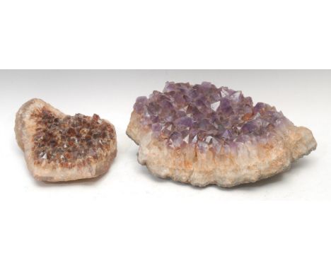 Geology - a large amethyst geode section, 33cm wide; another, citrine geode section, 22cm wide (2)