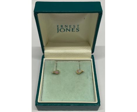 18ct Gold Opal and Diamond Stud Earrings Each earring is set with a pear cut cabochon opal and a melee round brilliant cut Di