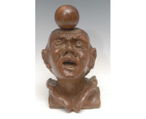 A 19th century oak novelty interior-architectural finial or newel post carving, as a comical man balancing a ball on his head