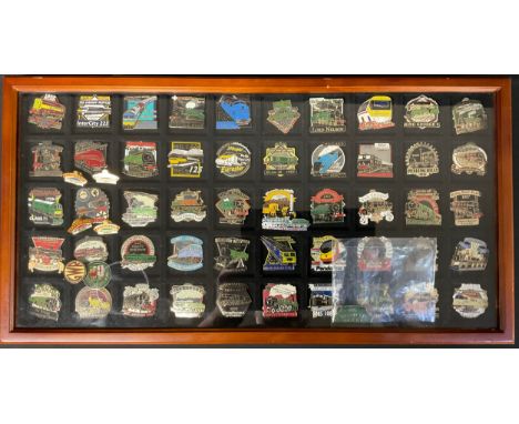 A collection of 50 Great British Locomotives Railway Enamel Lapel Badges by Danbury Mint complete in a fitted display frame. 