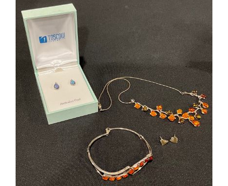A selection of Silver Jewellery;to include a "925" stamped articulated Amber necklace, a "925" stamped Amber bracelet, a pair