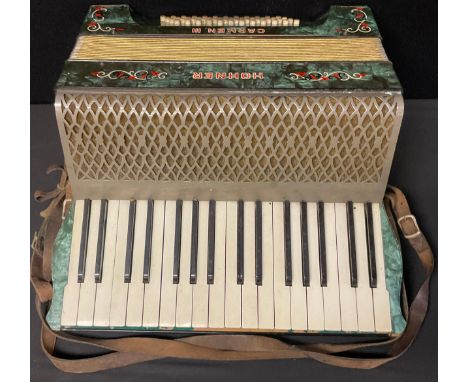 A Hohner Carmen III concertina