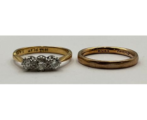 An 18ct Gold and Platinum Diamond Trilogy Ring with a 9ct Rose Gold Wedding Band A/F;the 18ct gold trilogy ring is set with t