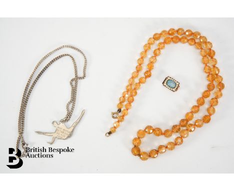 Antique glass necklace, approx 56 cms in length, held by a 14/15ct gold, set with a black opal 8 x 6mm surrounded by seed pea