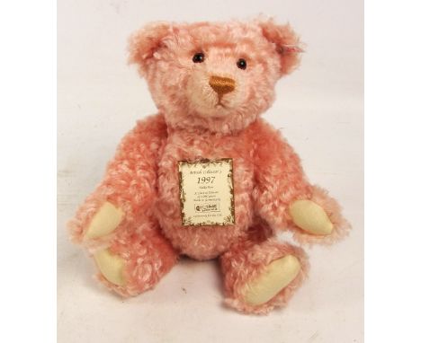 A boxed British Collectors' 1997 Steiff teddy bear, no. 654480, with numbered white and red tag to ear, with pink curly mohai