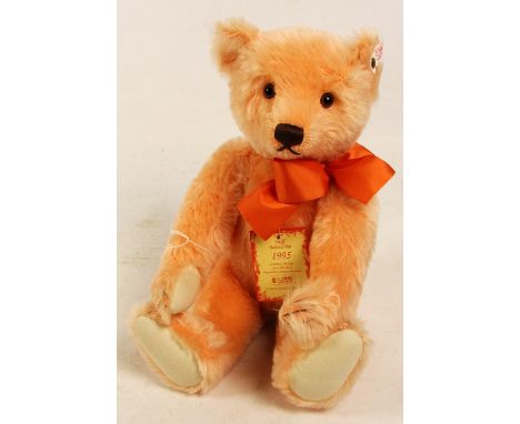 A boxed Steiff 1995 Holland teddy bear, no. 650857, with numbered white and red tag to ear, with pale orange mohair fur and o