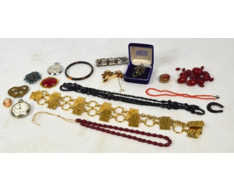 A cherry amber coloured graduated bead necklace, a tortoiseshell bangle, decorative costume jewellery, pocket watch etc.