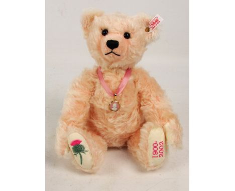 A boxed Steiff 2002 Queen Mother teddy bear no. 660887, with numbered white and red tag to ear, with curly pale pink mohair f