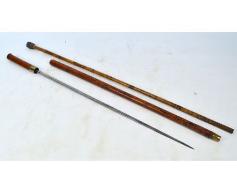 A late Victorian malacca shafted sword stick, length 83cm and a bamboo shafted walking cane associated multi face set silvere