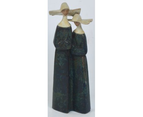 A Lladro salt glazed figure group of two nuns, height 34cm. CONDITION REPORT: Appears good with no obvious signs of faults, d