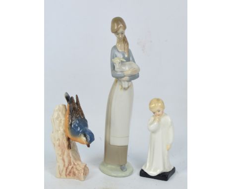 A Nao figure of a girl holding a lamb, height 27cm, a Royal Doulton figure HN1985 "Darling" and a Goebel figure of a nuthatch