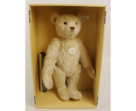 A boxed Steiff 1996 Replica 1921 teddy bear, no. 407123, with numbered white and black tag to ear, with clipped off white moh
