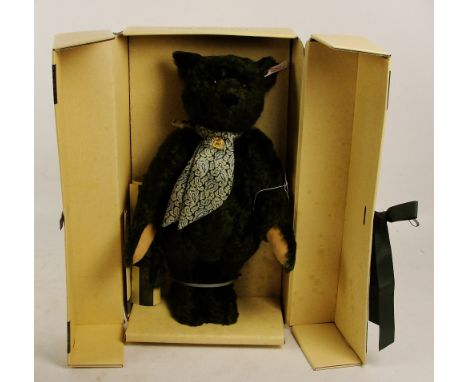 A boxed Steiff 1995 Harrods Centenary teddy bear, no. 653148, with numbered white and red tag to ear, with green fur, with si