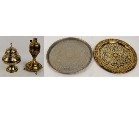 A group of four Eastern metal items comprising a footed bowl and cover with incised decoration, height 32cm, two circular tra