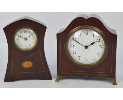 An Edwardian mahogany and line inlaid mantel timepiece with white enamel dial set with Arabic numerals and raised on bracket 