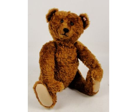A large Steiff "One in a Million" 1907 replica teddy bear, no. 666933, with numbered white and red tag to ear, with cinnamon 