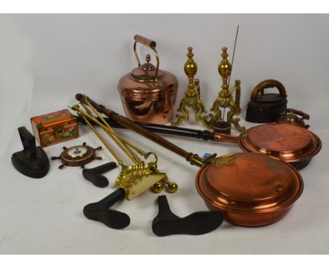 A quantity of metalware including a Victorian copper kettle, two warming pans, pair of brass andirons, an Otto gas flatiron, 