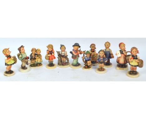 Twelve various Goebel/Hummel figures including children with baskets.