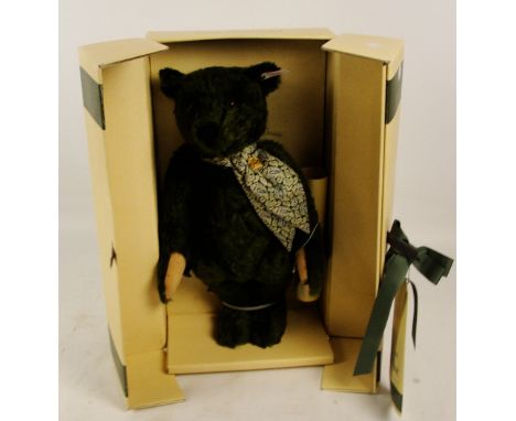 A boxed Steiff 1995 Harrods Centenary teddy bear, no. 653148, with numbered white and red tag to ear, with green fur, with si