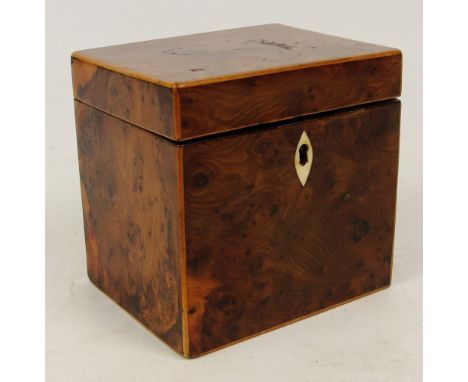 A 19th century burr yew wood tea caddy of rectangular form with bone escutcheon, 9 x 11.5 x 11.5cm.