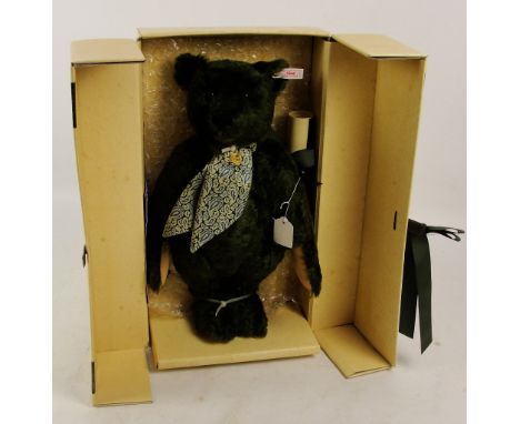 A boxed Steiff 1995 Harrods Centenary teddy bear, no. 653148, with numbered white and red tag to ear, with green fur, with si