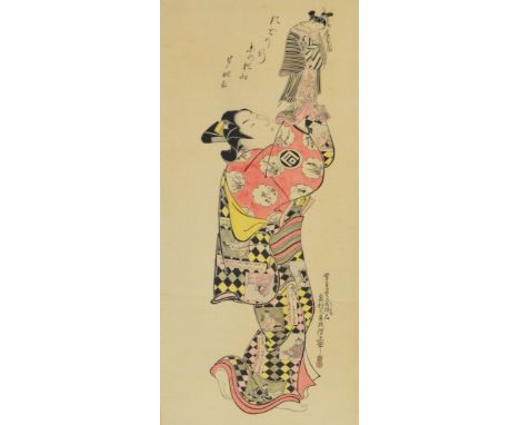 AFTER OKIMURA MASANOBU; a large Japanese wood block print, "The actor Sanogawa Ichimatsu as a puppet player", 67 x 26.5cm, mo