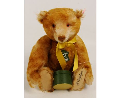 A boxed Steiff 1997 Extravagance bear, retailed by Harrods, no. 653179, with numbered white and red tag to ear, with cinnamon