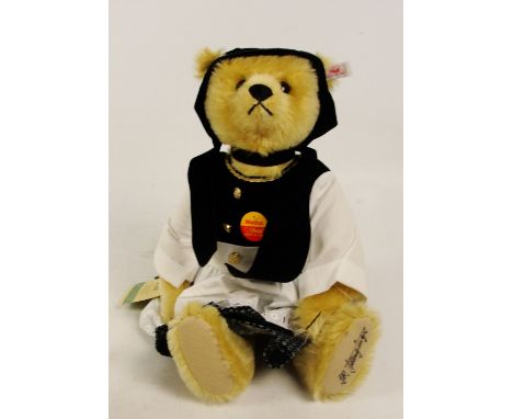 A boxed Steiff Metha teddy bear, no. 655210, with numbered white and red tag to ear, with blonde mohair fur, dressed in tradi