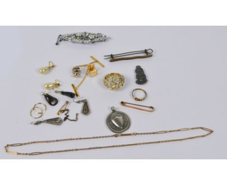 A small quantity of costume jewellery including a 9ct gold stick pin, circular medallion, chain, brooch, ring and earrings.