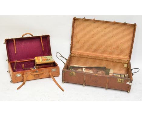 A leather suitcase with twin handles and straps, also a vintage trunk (2).