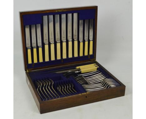 A cased six setting canteen of electroplated cutlery comprising dinner forks, dessert forks, dessert spoons, teaspoons, a pai