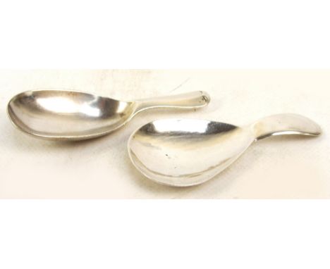 A George V hallmarked silver caddy spoon of plain form, Thomas Bradbury & Sons Ltd, Sheffield 1910, length 8cm, and a further