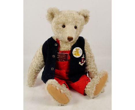 A large boxed Steiff 1994 replica 1908 teddy bear, no. 406041, with numbered white and black tag to ear, with curly off white