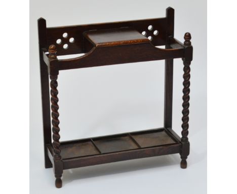 An early 20th century oak two division stick/umbrella stand.