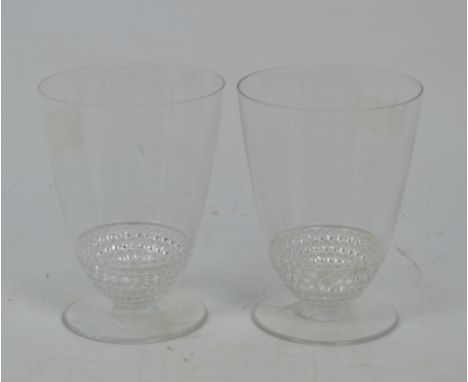 A pair of Lalique tumblers with five rows of beading to base, etched signature (2). CONDITION REPORT: "R . Lalique" etched in