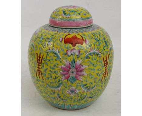 A large 20th century Chinese ginger jar painted in enamel with auspicious character marks alternating with floral sprays, wit