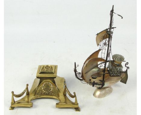 An early 20th century novelty inkwell constructed from shells, modelled as a masted boat with metal details and clear glass i