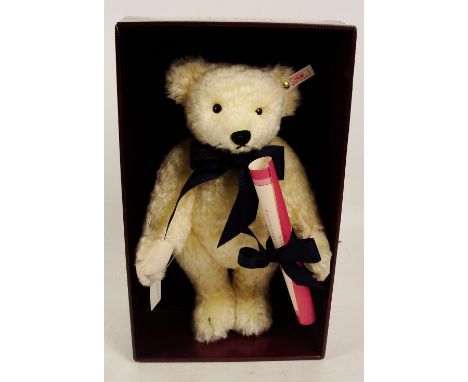 A boxed Steiff 1994 Charlotte teddy bear, no. 652813, retailed by Hamleys, with numbered white and red tag to ear, with off-w