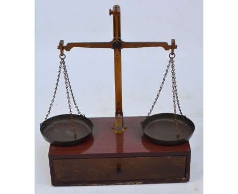 A set of early 20th century mahogany jewellers' scales with weights, width 26.5cm.