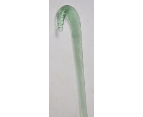 A late Victorian novelty pale green tinted and slightly wrythen moulded glass walking stick, length 108.5cm.