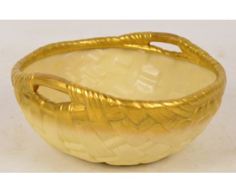 A Royal Worcester blush ivory bowl modelled as a woven twin handled basket, green printed marks to base, no.G441, length 23cm