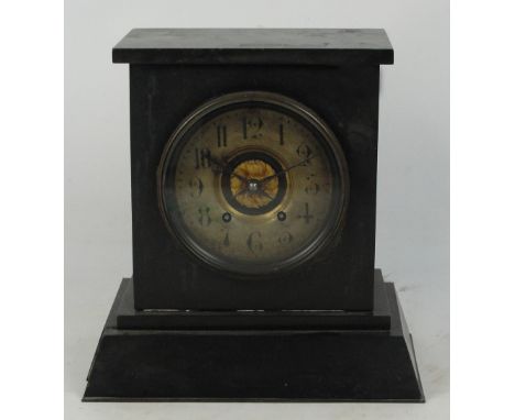 A late 19th century French black slate mantel clock with circular chapter ring set with Arabic numerals (af).