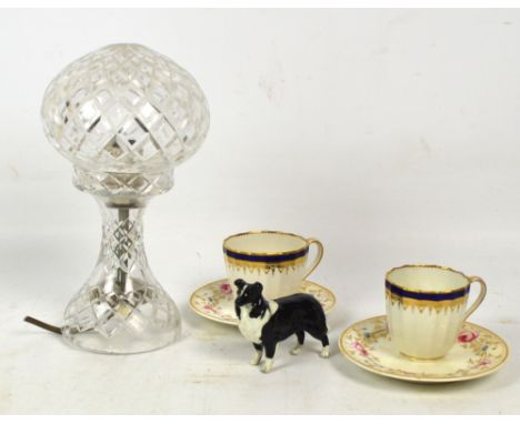 A cut glass table lamp with domed cut glass shade, a model of a Collie dog and two Bloore Derby floral decorated saucers with